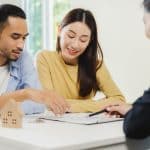 Real estate agents explain the document for customers before a c